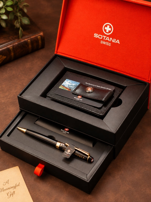A Swiss gift set by Sotania Swiss, featuring a black leather wallet and a black pen with gold accents, presented in a two-tier black gift box with a bright red inner lid.