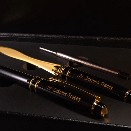 The box opens to display a personalized pen and a matching letter opener.
